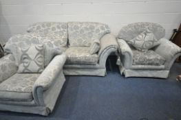 A PALE TEAL AND FLORAL UPHOLSTERED THREE PIECE SUITE, comprising a three seater sofa, length 220cm x
