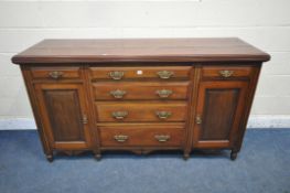 A 20TH CENTURY WALNUT DRESSER BASE, fitted with an arrangement of six drawers and two cupboard