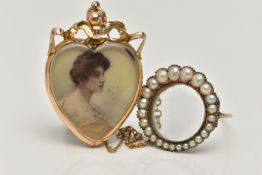 TWO EARLY 20TH CENTURY JEWELLERY ITEMS, the first a heart form double sided photo pendant, with