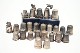 A SELECTION OF SILVER THIMBLES, twenty-six thimbles in total, various designs and patterns, all with