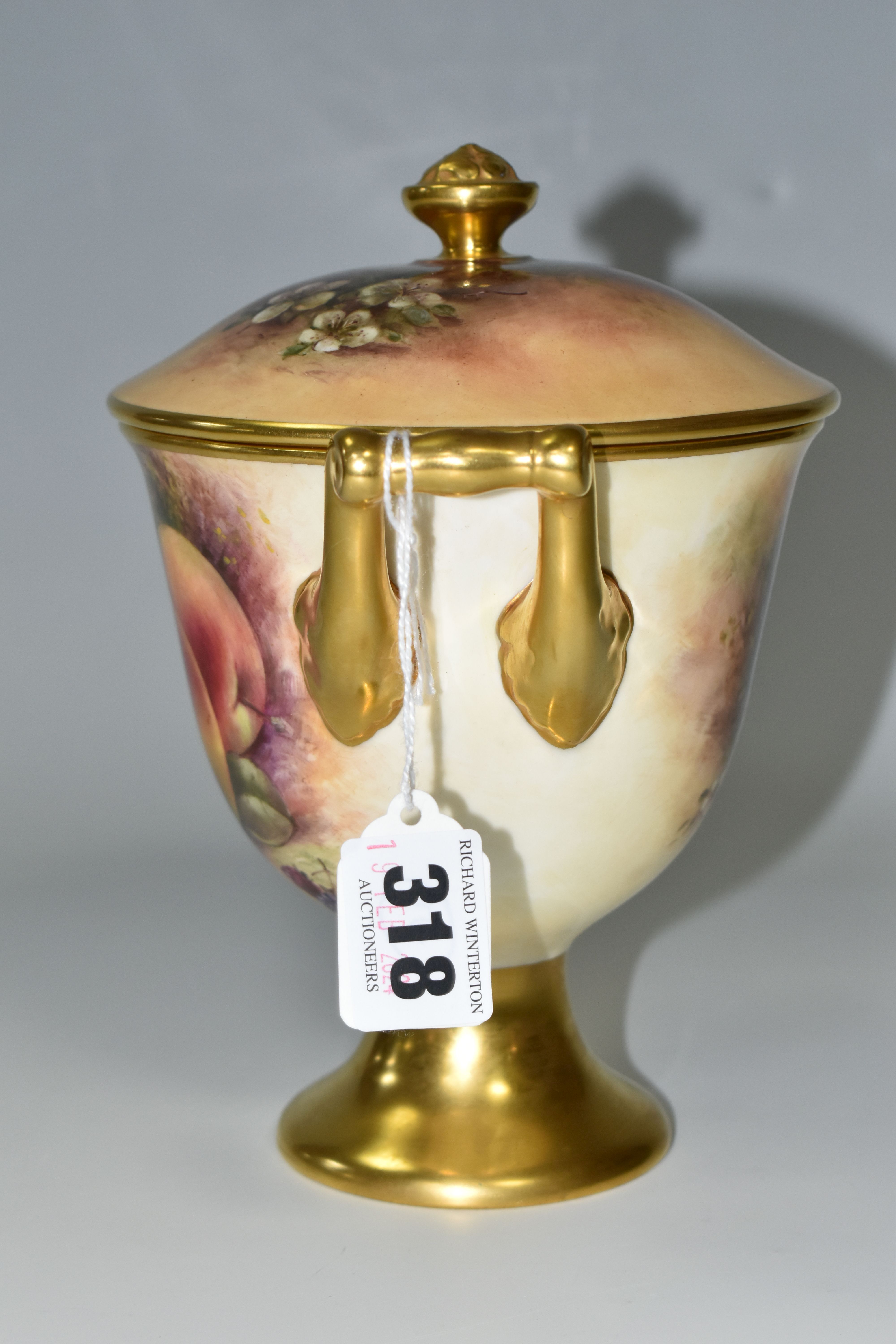 A COALPORT COVERED VASE, the gilt footed vase with twin gilt handles, hand painted with apples, - Image 2 of 8