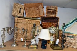 A GROUP OF LAMPS, CANDLESTICKS AND WICKER BASKETS, to include a pair of brass column style table
