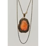 A CONTINENTAL PENDANT, the Chinese style pendant designed as a polished agate within a floral and