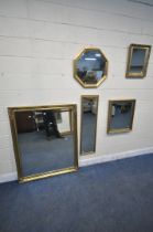 A LARGE GILT FRAMED BEVELLED EDGE WALL MIRROR, 129cm x 106cm, and four other gilt framed wall