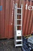 AN ALUMINIUM TRIPLE EXTENSION LADDER with 7 rungs to each LP 222cm section and a pair of steps (2)