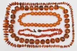FOUR NECKLACES, to include a branch coral necklace, a heated amber necklace, and two plastic bead