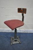 A SINGER INDUSTRIAL CAST IRON AND BENTWOOD ADJUSTABLE MACHINISTS STOOL, upholstered seat pad,