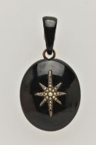 A LATE VICTORIAN JET AND SEED PEARL PENDANT, of oval outline with central elongated star set with