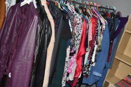 A LARGE QUANTITY OF LADIES' CLOTHING, to include leather jackets, overcoats, blouses, skirts,