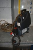 A PERFORMANCE 6 LTR 1.5HP AIR COMPRESSOR, with a later extra long reach hose (PAT pass and working)