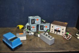 A TRAY CONTAINING POWER SUPPLIES AND BATTERY CHARGERS including three Pye BC-2T, a Stevens ST-75, an