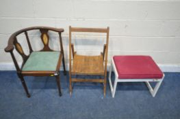 A 20TH CENTURY MAHOGANY CORNER CHAIR, with swept armrests, raised on turned supports and a pair of