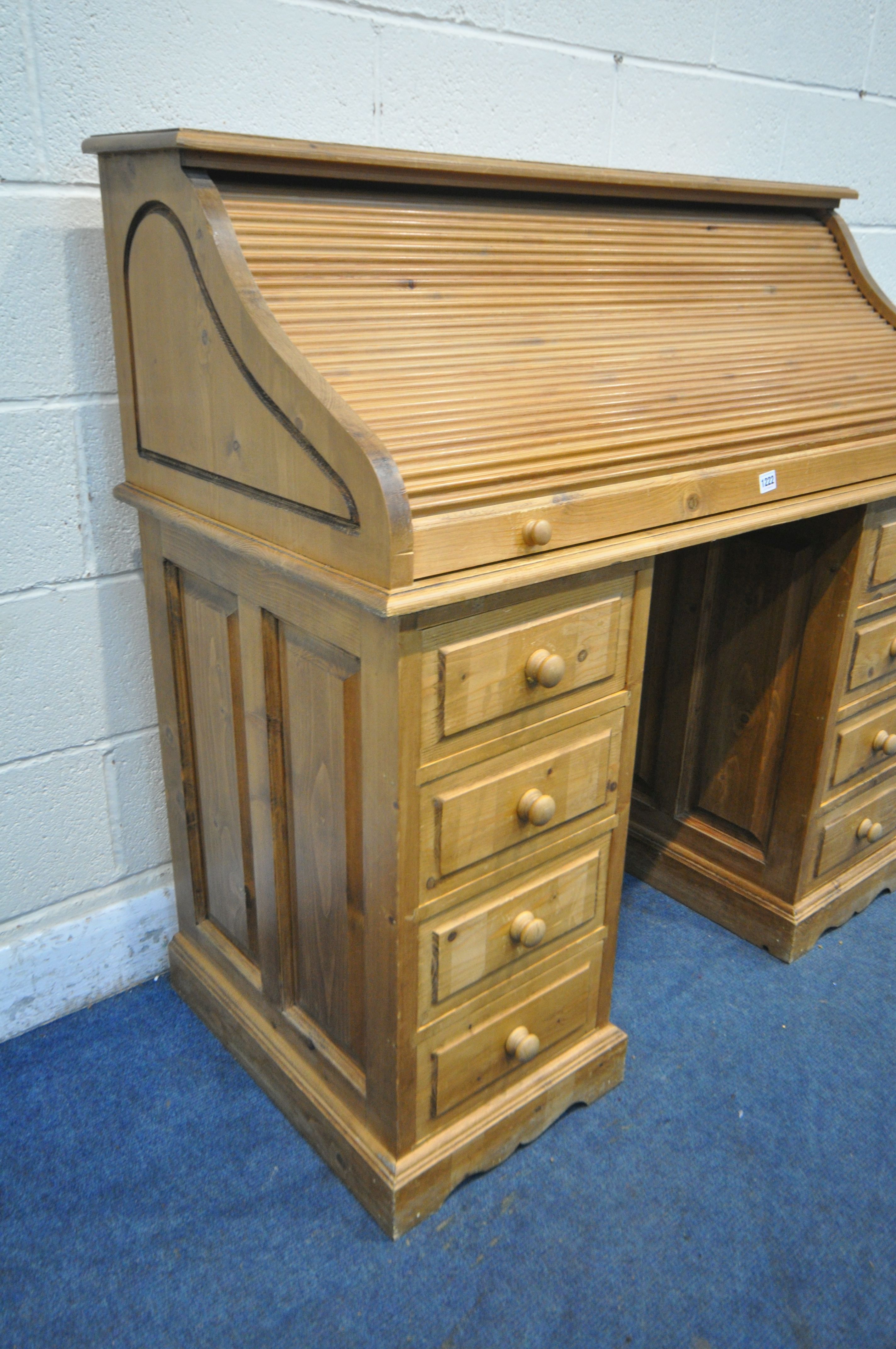 A PINE ROLL TOP PEDESTAL DESK, enclosing an arrangement of shelving and drawers, over a two eight - Image 2 of 4