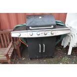 A MICHIGAN FOUR BURNER GAS BARBECUE WITH SIDE BURNER, cupboard below and tatty cover width126cm