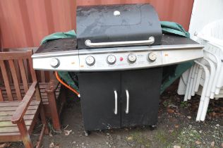 A MICHIGAN FOUR BURNER GAS BARBECUE WITH SIDE BURNER, cupboard below and tatty cover width126cm