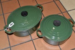 TWO LE CREUSET CACTUS GREEN CASSEROLE DISHES, comprising an oval covered cast iron casserole dish