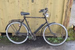A VINTAGE RALEIGH SPORTS GENTS BIKE with 3 speed gears, Iscaselle saddle, 23in frame, front and rear