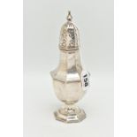 A GEORGE V SILVER SUGAR CASTER, faceted form, pierced cover with pointed finial, on a weighted base,