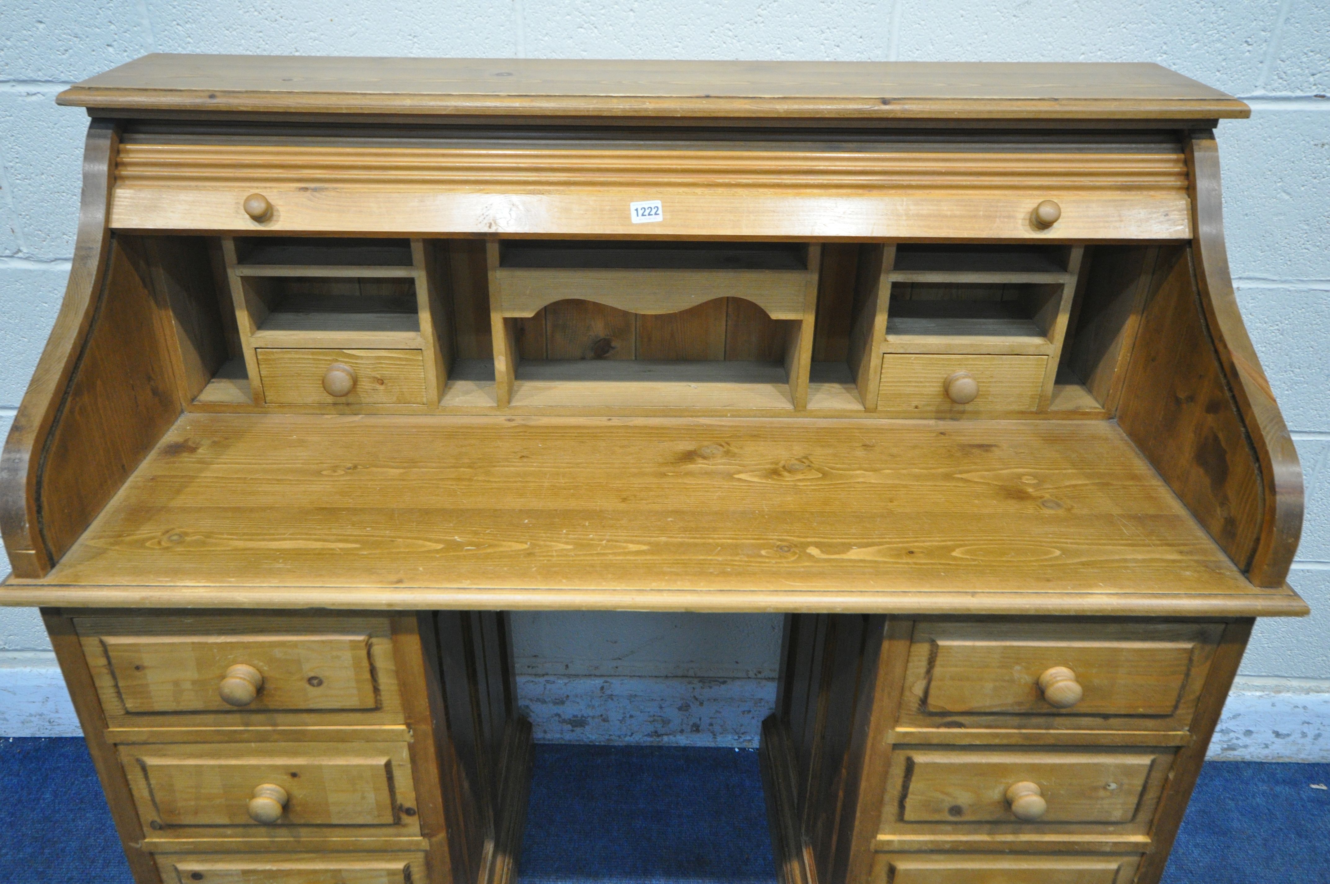 A PINE ROLL TOP PEDESTAL DESK, enclosing an arrangement of shelving and drawers, over a two eight - Image 3 of 4