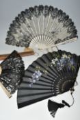 THREE FOLDING FANS, comprising a boxed mother of pearl and black lace fan, with painted flowers