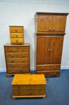A SELECTION OF MODERN PINE BEDROOM FURNITURE, to include a double door wardrobe, with top box, and