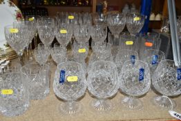 A SELECTION OF STUART DRINKING GLASSES, to include eight brandy balloons, seven white wine, five