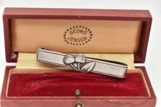 A 'GEORG JENSEN' 'CHERRY HEERING' TIE CLIP, designed as a pair of cherries to the plain bar for