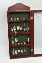A CASE OF ASSORTED SILVER AND WHITE METAL SPOONS, a selection of seven silver souvenir spoons and an