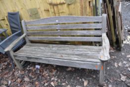 A SAWN HATTERSLEY HARDWOOD GARDEN BENCH with weathered slatted seat and back width 162cm