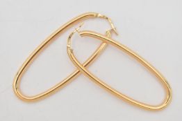 A PAIR OF 9CT GOLD HOOP EARRINGS, large oval hollow hoops, length 58.6mm, width 23.2mm, lever