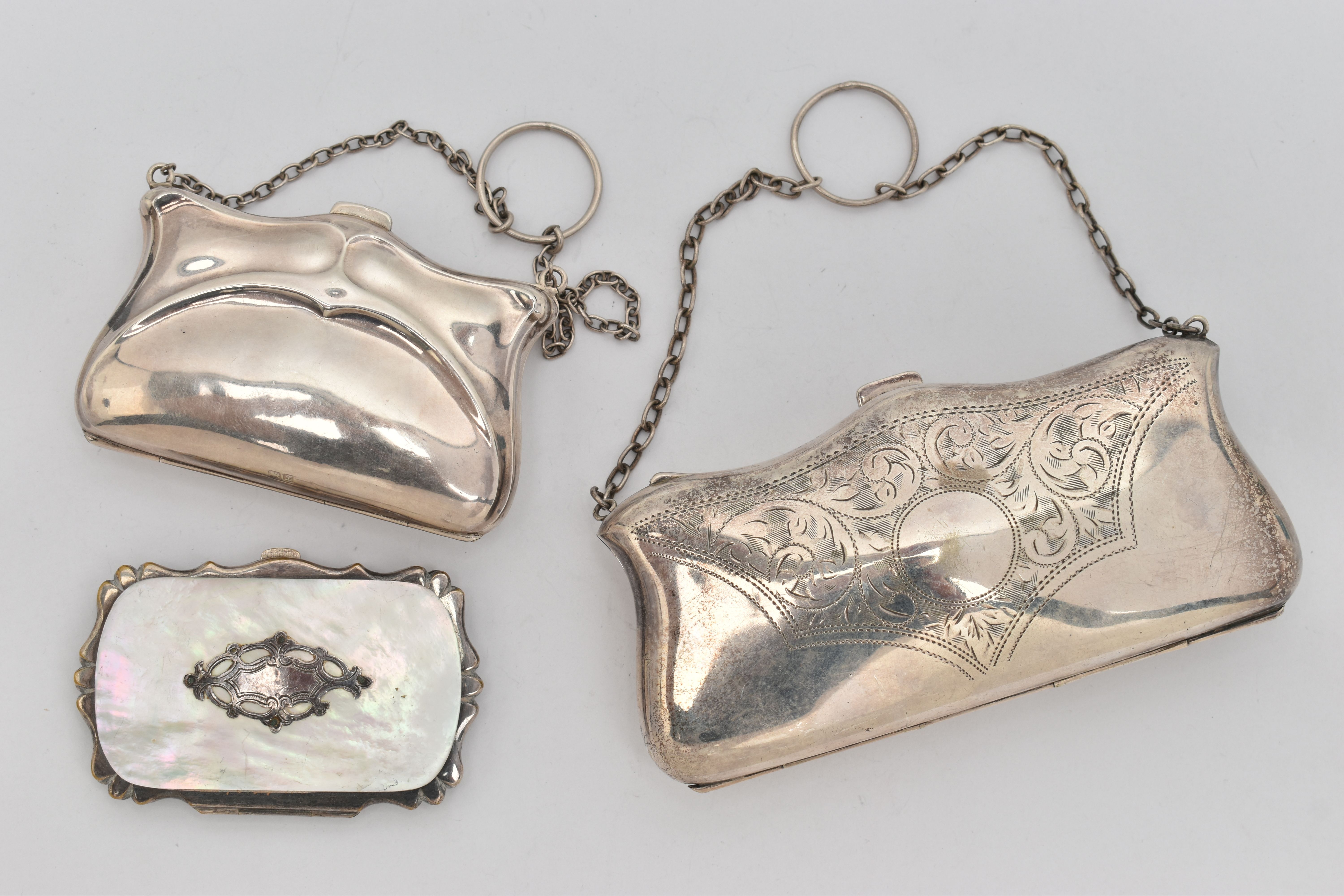 A SILVER COIN PURSE AND TWO OTHERS, an early 20th century silver Art Nouveau pattern purse,