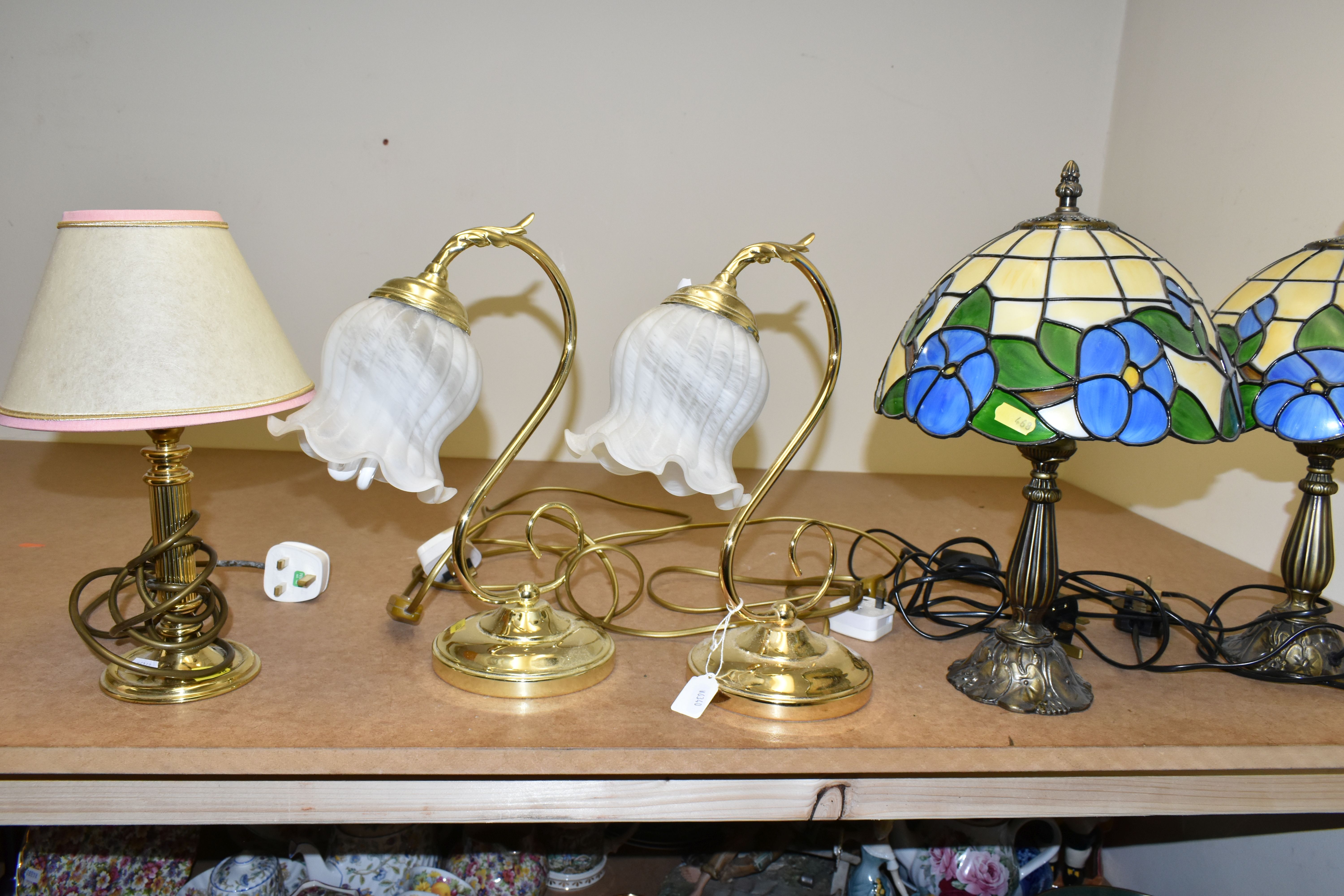 A GROUP OF TABLE LAMPS, to include a pair of 'Tiffany' style lamps with coloured plastic shades, a