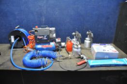 AN AIRMASTER TIGER 4/6 TURBO COMPRESSOR (PAT pass and working) along with a hose reel, a curly hose,