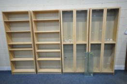 TWO PAIRS OF IKEA BOOKCASES, two with double glazed doors and an arrangement of glass shelves, width