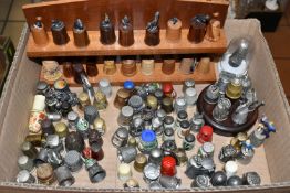 A TRAY OF PEWTER, ENAMEL AND WOODEN THIMBLES, comprising souvenir pewter thimbles, Warwick Model
