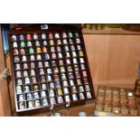 ONE HUNDRED AND TWENTY-EIGHT COLLECTORS THIMBLES, to include Robertsons jam mascot thimbles,