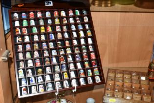 ONE HUNDRED AND TWENTY-EIGHT COLLECTORS THIMBLES, to include Robertsons jam mascot thimbles,