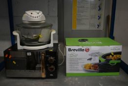 A BOXED AND UNUSED BREVILLE HALO HEALTH FRYER, an egl microwave, and a Russell Hobbs steamer (ALL