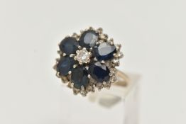 A LARGE 18CT GOLD SAPPHIRE AND DIAMOND CLUSTER RING, six oval cut sapphires and a central round
