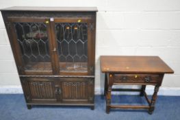 A 20TH CENTURY OAK JAYCEE BOOKCASE, with double lead glazed doors above double linenfold doors,