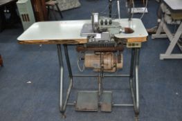 A WILCOX AND GIBBS 500/IV TYPE 504/IV OVERLOCKING SEWING MACHINE mounted into a worktable table