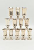 A SET OF TWELVE SILVER LIQUOR/SHERRY CUPS, tapering on round based, gilt interiors, hallmarked 'A