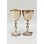 A PAIR OF ELIZABETH II SILVER COMMEMORATIVE GOBLETS, polished cups with gilt interior, engraved '