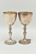 A PAIR OF ELIZABETH II SILVER COMMEMORATIVE GOBLETS, polished cups with gilt interior, engraved '
