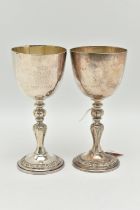 A PAIR OF ELIZABETH II SILVER COMMEMORATIVE GOBLETS, polished cups with gilt interior, engraved '