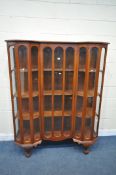 A LARGE 20TH CENTURY MAHOGANY DISPLAY CABINET, with a single door, flanked by a half hexagon design,