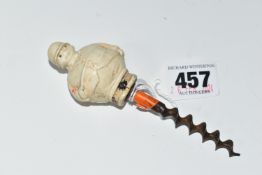 A 1920S NOVELTY CORKSCREW, the celluloid handle in the form of a chubby huntsman, height of figure