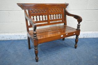 AN ANGLO INDIAN COLONIAL STYLE HARDWOOD CHILDS BENCH, carved with geometric designs, scrolled