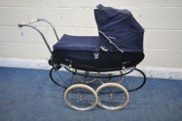 A DARK BLUE VINTAGE SILVER CROSS STYLE CHILDS PRAM, with a crown symbol to each side, along with a