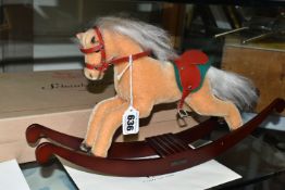 A BOXED STEIFF LIMITED EDITION ROCKING HORSE, with beige mohair covering, red leather saddle and a